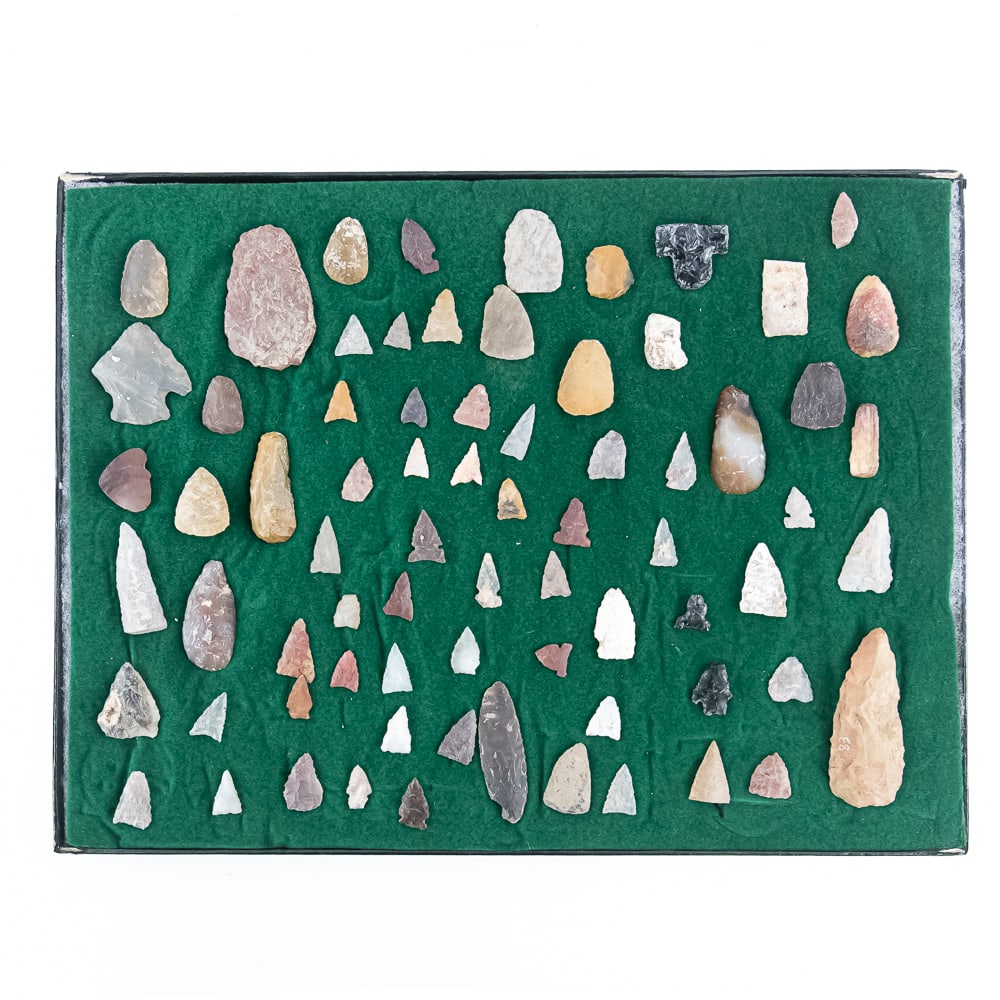 73pc Native American Point Collection: This impressive collection features 73 hand-knapped stone points and tools, showcasing a diverse array of lithic materials including chert, flint, jasper, and chalcedony. The assemblage includes a var