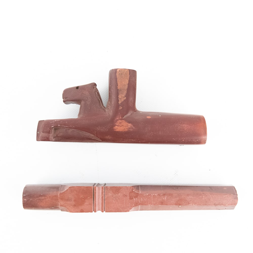 Horse Effigy Catlinite Pipe & Stem: This exquisite two-piece ceremonial pipe is expertly hand-carved from Catlinite (red pipestone), a material traditionally sourced from the quarries of Minnesota and sacred to many Plains Tribal