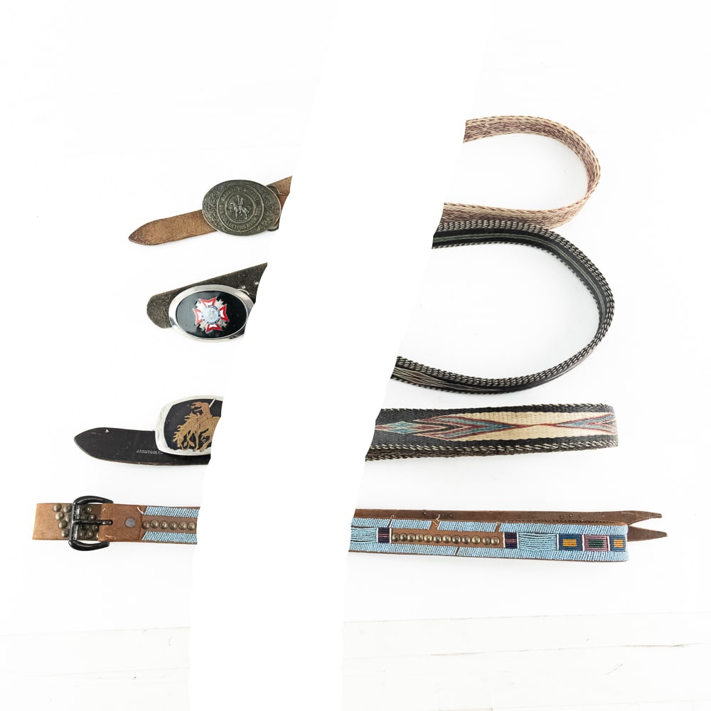 Four Vintage Western & Commemorative Belts: This collection features four diverse Western and commemorative belts: a striking 67" turquoise beaded leather belt with brass studs, a hand-hitched horsehair belt with a "Dakota Territory Gun