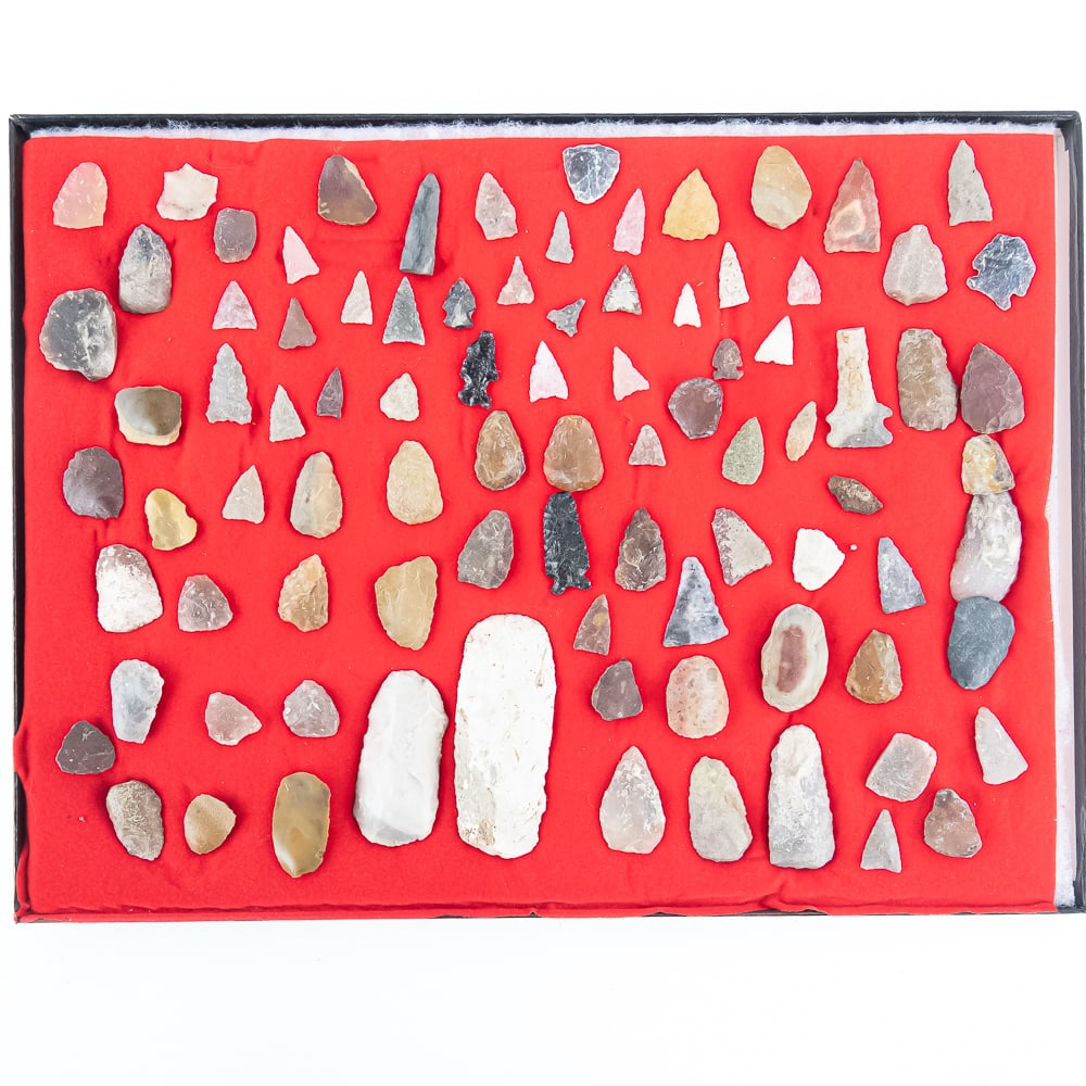 88pc Diverse Lithic & Projectile Point Col.: This expansive collection features 88 distinct lithic artifacts, showcasing a remarkable variety of North American projectile point styles, scrapers, and bifacial tools. The assembly includes a vibran