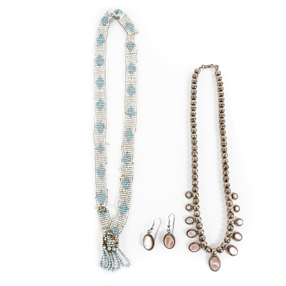 Chippewa & Navajo Jewelry Collection: This offering features a significant historic Chippewa loom-beaded necklace alongside a classic Navajo silver and mother-of-pearl jewelry suite. The Chippewa necklace is a masterclass in Great Lakes