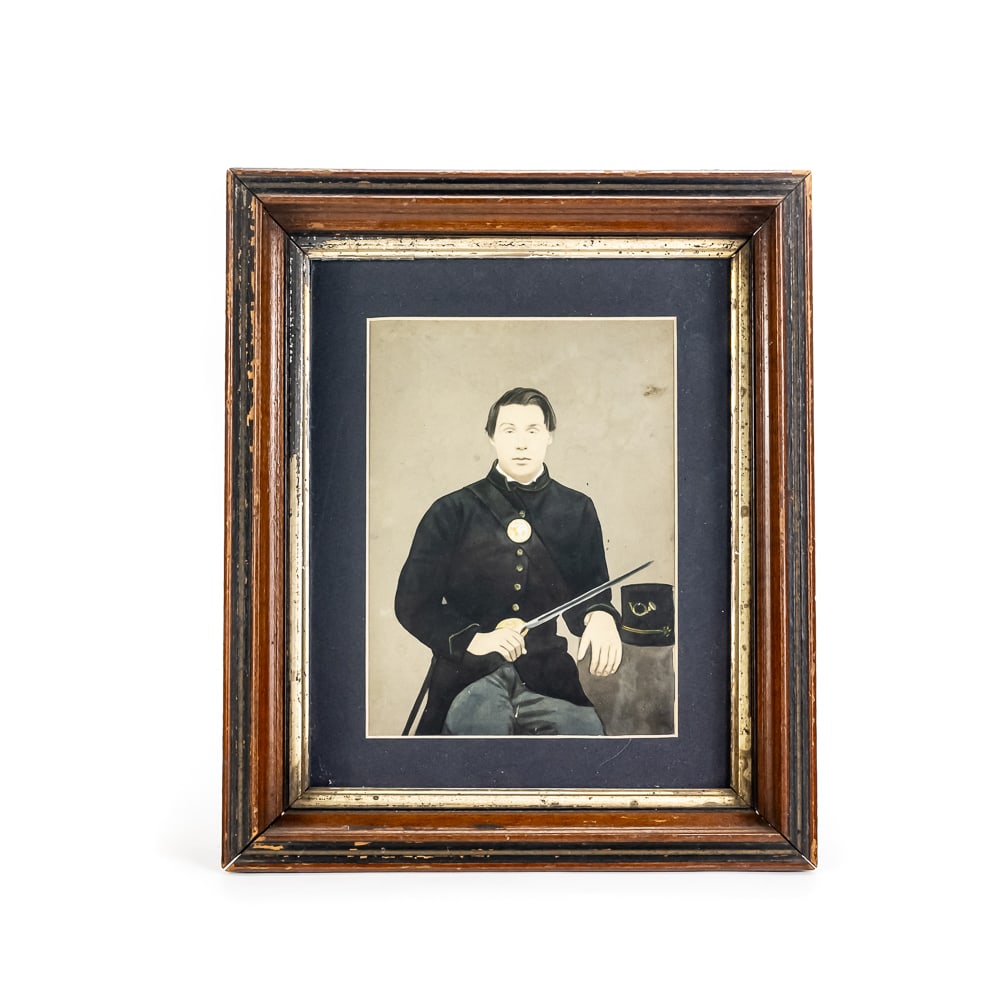 Framed Civil War "Iron Brigade" Solar Portrait: This hand-enhanced solar enlargement features a Union soldier identified via a verso inscription as a member of the "Iron Brigade." The artwork utilizes the "crayon portrait" technique, where a