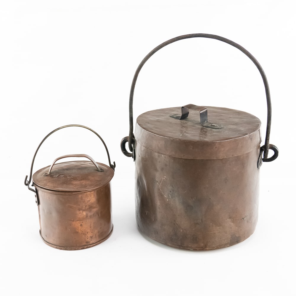 Antique Copper Mess Kettles & Lid: This exceptional trio of antique copper cookware showcases the rugged durability of historic utilitarian design, featuring two hand-hammered copper mess kettles with fitted lids and iron bale