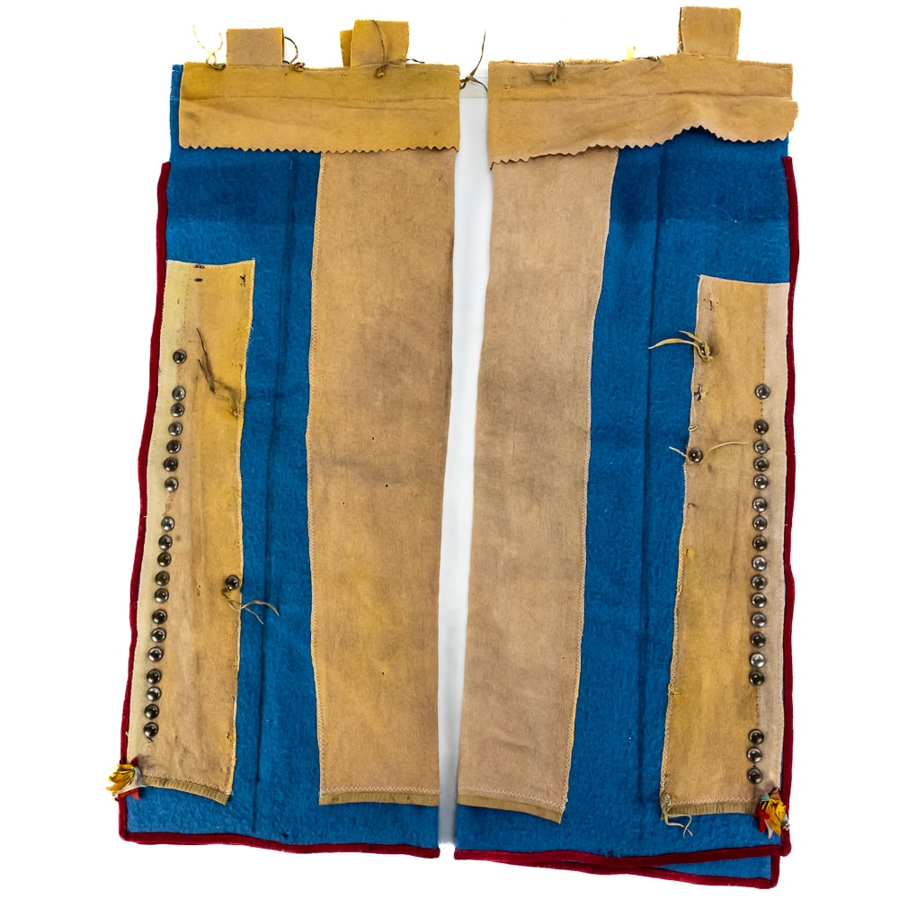 Frontier Style Reproduction Leggings: This exceptionally striking pair of contemporary, frontier-style military reproduction leggings features a vibrant blue wool felt body accented with deep red wool binding and heavy buckskin leather