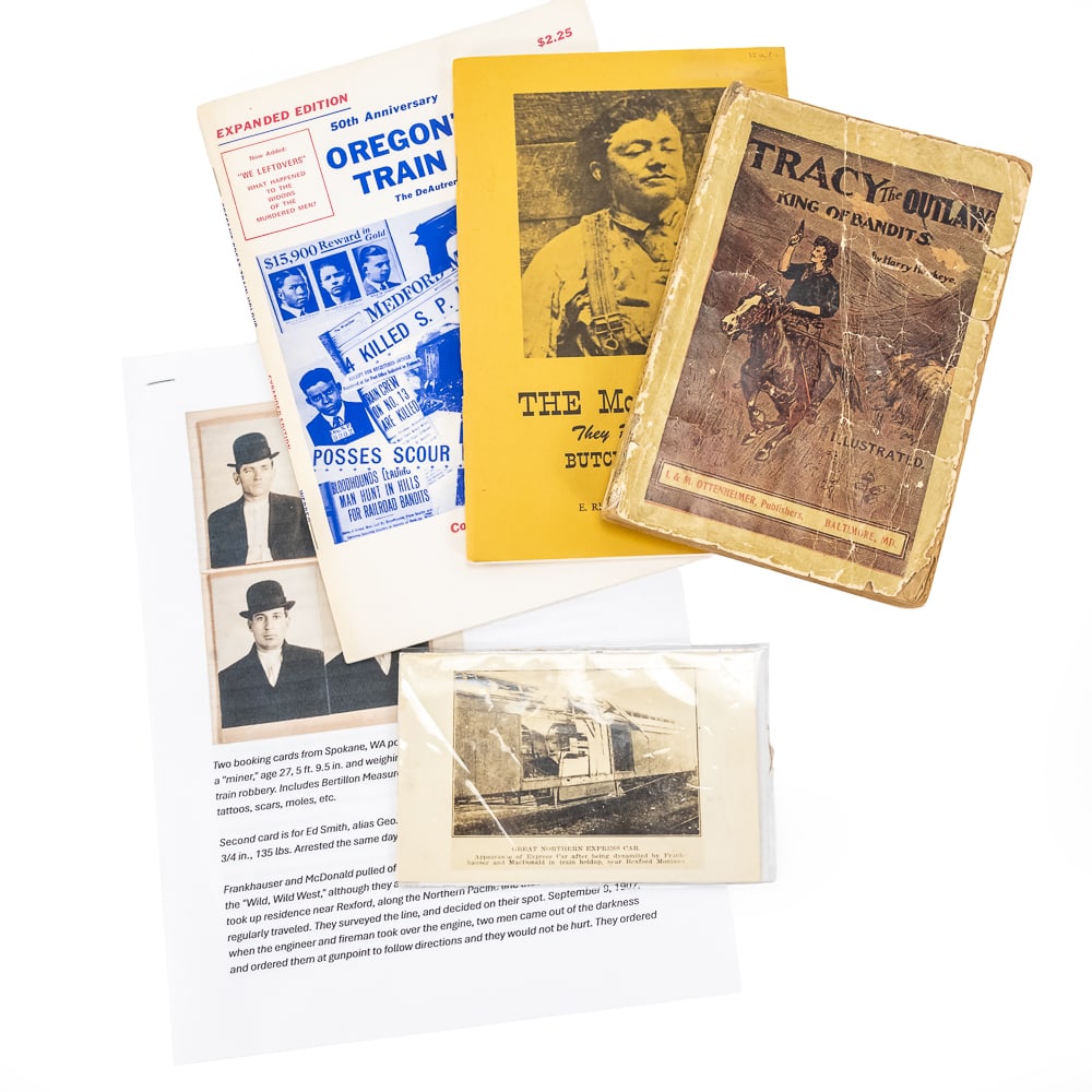 Vintage Outlaw & Train Robbery Archive: This fascinating lot of Western Americana captures the high-stakes era of early 20th-century outlaws, featuring a 1908 edition of Tracy the Outlaw: King of Bandits by Harry Hawkeye, published by I. & 