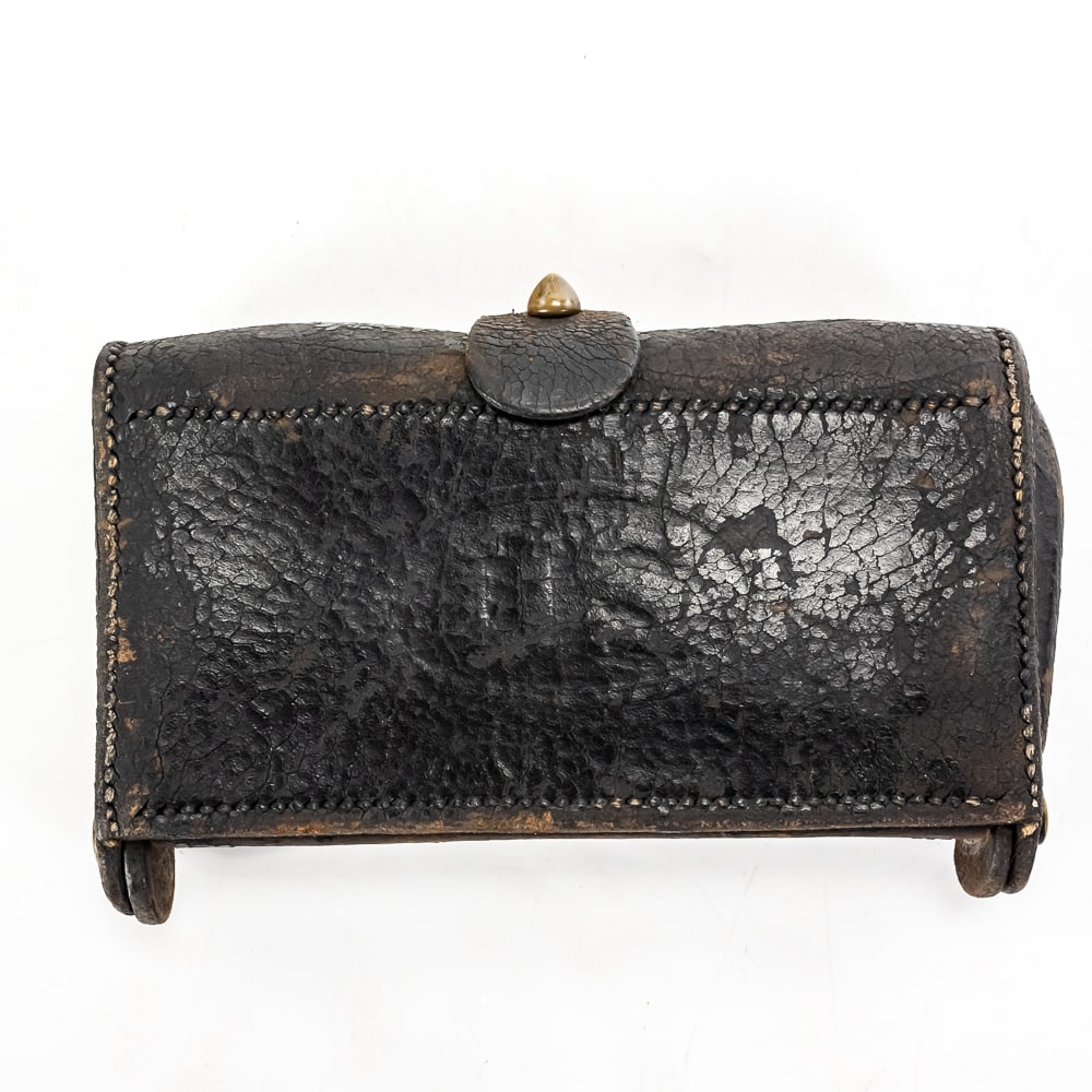 US Indian Wars McKeever .50-70 Ammo Pouch W/2 Rnds: This is an authentic U.S. military McKeever pattern cartridge pouch, an iconic Indian Wars-era design featuring a black leather exterior embossed with the classic "U.S." oval graphic, a brass closure
