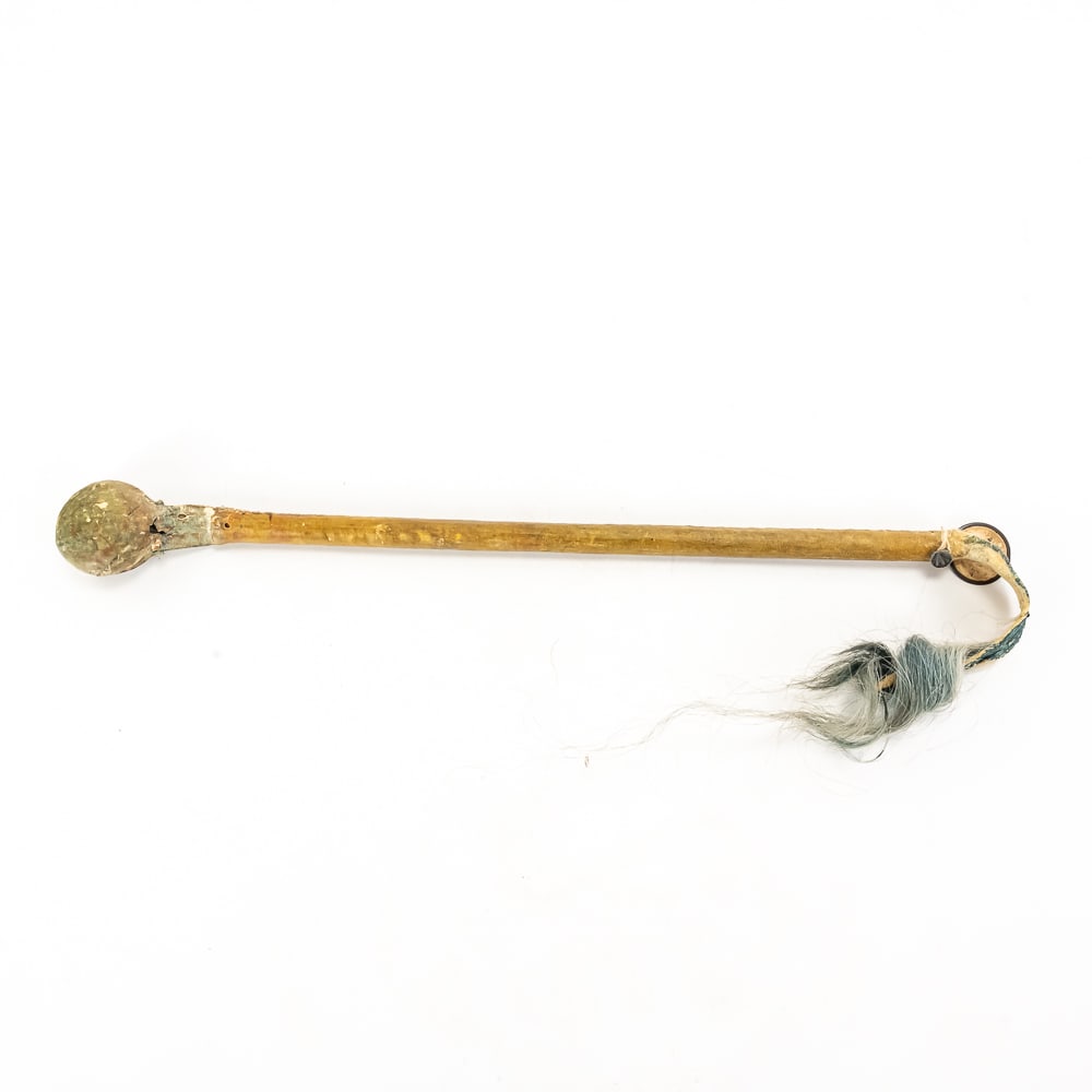 Native American Stone Skull Cracker: This classic mid-to-late 19th-century Plains-style skull cracker or war club is a textbook example of indigenous defensive weaponry. The piece features a weighted, spherical stone head securely