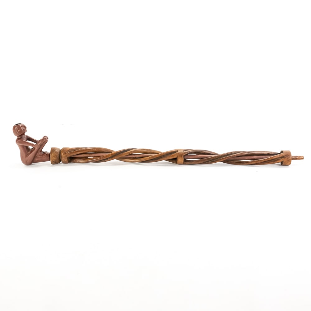 Native American Catlinite Figural Pipe: This remarkable ceremonial-style long pipe features a hand-carved catlinite (pipestone) bowl in the form of a seated anthropomorphic figure, likely of Plains Indian origin dating to the mid-to-late