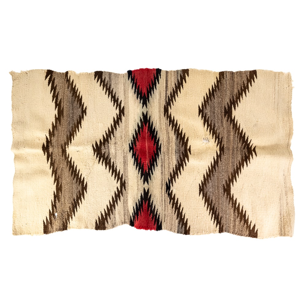 Navajo Style Eye Dazzler Weaving: This striking textile showcases a classic Navajo-style "Eye Dazzler" aesthetic, heavily influenced by late 19th-century Southwest regional designs. Woven from coarse, natural wool fibers, it features
