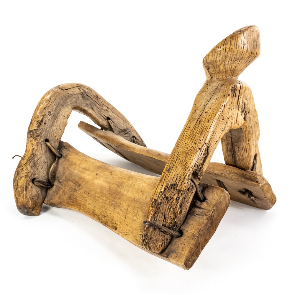 Antique Apache Hand-Carved Wood Saddle: This remarkable piece of utilitarian art is a hand-carved wood saddle, attributed to the Apache people and dating to the 1800s or possibly earlier. Expertly crafted from only four primary pieces of
