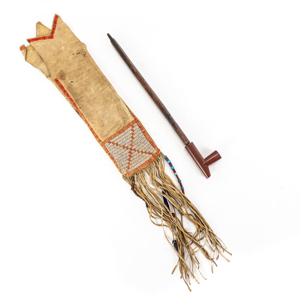 Native American Quilled Pipe Bag & Catlinite Pipe: This remarkable Plains-style ensemble features a hand-stitched buckskin pipe bag and a ceremonial two-piece pipe. The bag is expertly crafted with traditional quillwork or beadwork accents along the