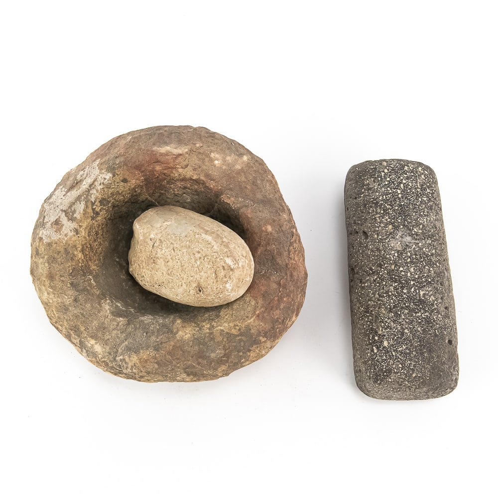 Native American Stone Mortar & Mano Set: This primitive Native American grinding set, featuring a substantial stone mortar and two manos (grinding stones), represents the essential lithic technology used for processing maize, nuts, and