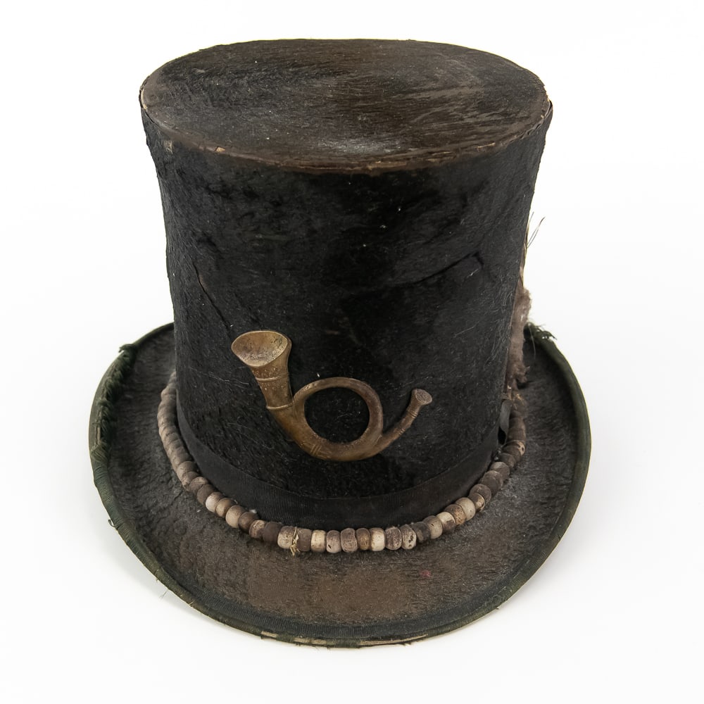 Repurposed Native American Trade Top Hat: This compelling artifact represents the cross-cultural "frontier" style of the late 19th century, where military surplus was often repurposed into Native American regalia. The tall crown is