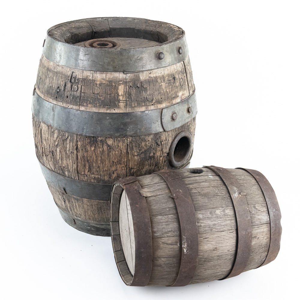Antique Beer Barrel Set: A set of two antique oak barrels, utilized for beer or spirits. The larger and rarer of the barrels shows the stamping of “PERPLIES BRG CO / Jefferson, Wisconsin”. The Henry Perplies