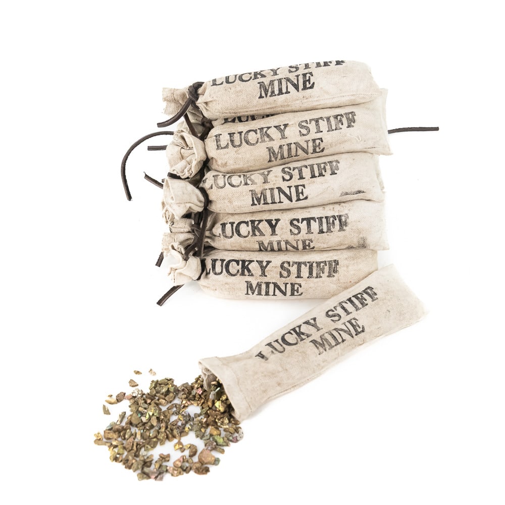Lucky Stiff Mine Bags: Lot of 16, "Lucky Stiff Mine" bags. Made of canvas, each bag is filled with pyrite and closed with a leather tie. These bags are great for a mining or Western display or to add character to your