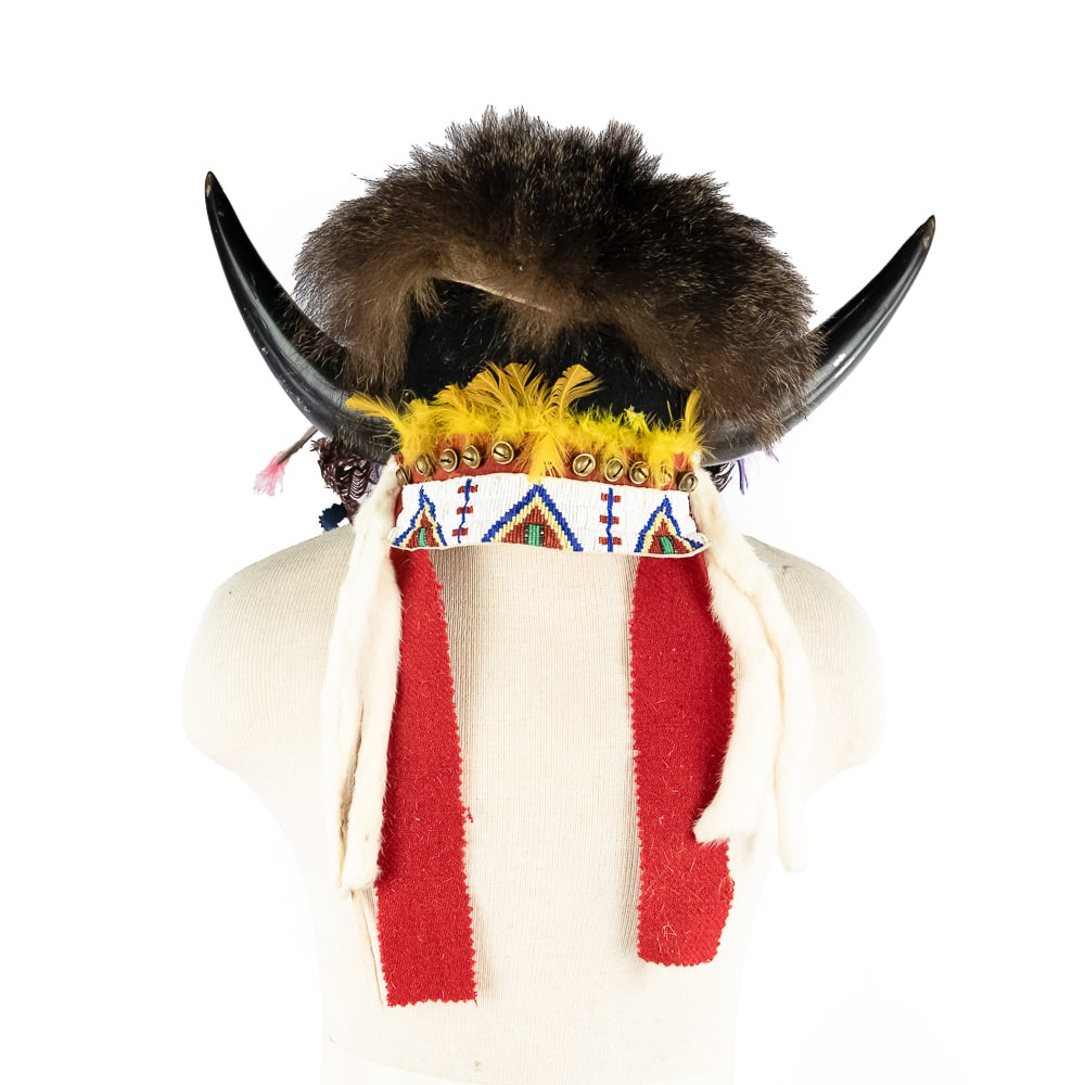 Modern Crafted Trad. Sioux Buffalo Headdress: Modern Sioux Buffalo Horn HeaddressThis is an impressive modern Sioux Buffalo horn headdress. It features a dark blue wool cap, of which a split Buffalo horn is affixed on either side. The headband