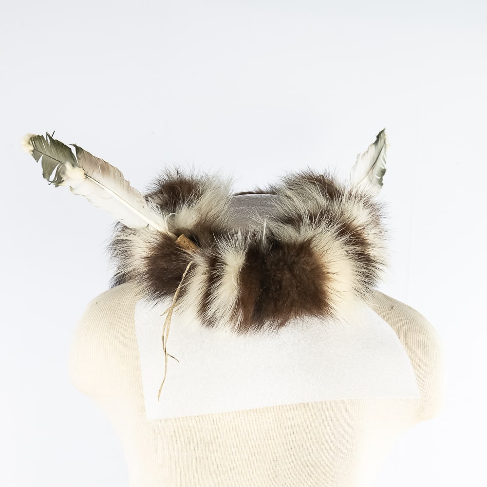 Modern Sioux Fur and Feather Headdress: Modern Sioux Fur and Feather HeaddressThis is a modern Sioux fur and feather headdress featuring a central head ring of dark brown and white striped fur forming the foundation for the headdress. The