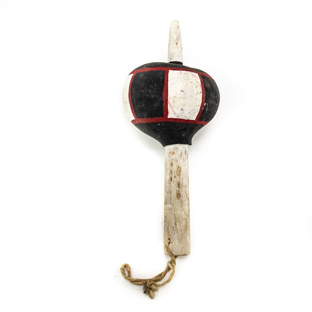 Hopi Ceremonial Gourd Rattle: This is a Hopi gourd rattle traditionally used in ceremonies and dances. The rattle features a spherical gourd body painted a flat black and white with geometric designs and outlined in red. A sturdy