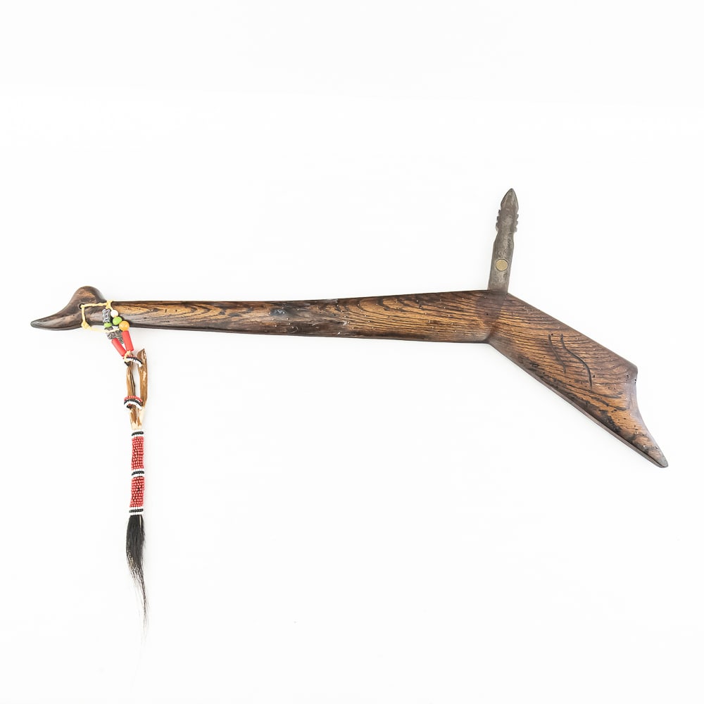 Gunstock Club w/Beaded Drop: Gunstock Club w/Beaded DropThis gunstock war club likely dating to the late 19th or early 20th century. Serving as both a weapon and a symbol of status, this beautiful club is constructed from