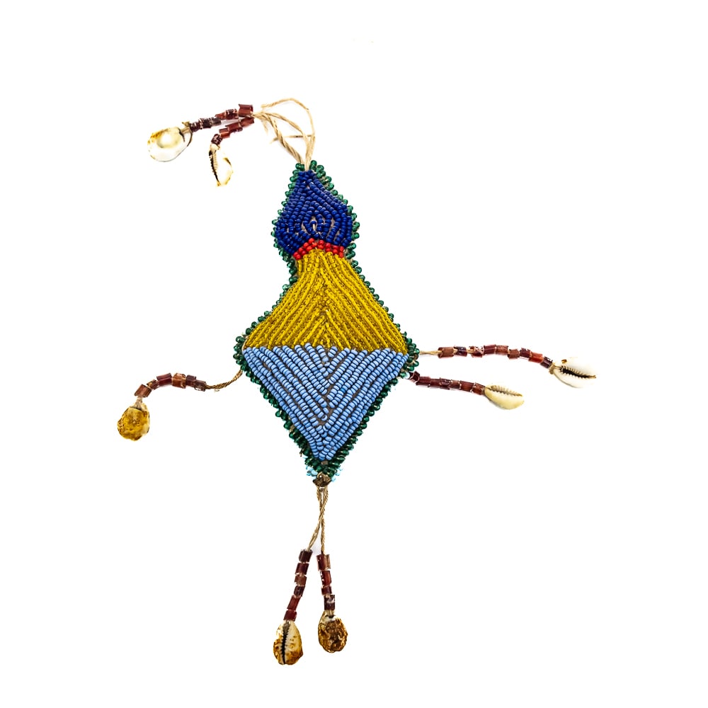 Umbilical Fetish: This is an umbilical fetish, likely from Sioux or other Plains Indian tribes. Partially diamond shaped, it is adorned with glass seed beads of different colors including: blue, red, yellow, dark blue,