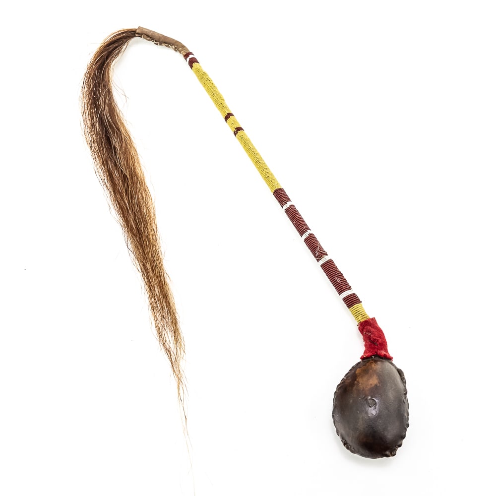 Plains Indian Floppy Head War Club w/Beaded Handle: Plains Indian Floppy Head War Club w/Beaded HandleThis “Floppy Head” Plains Indian war club also referred to as a skull cracker. It features a stone head wrapped in hide attached to a rigi