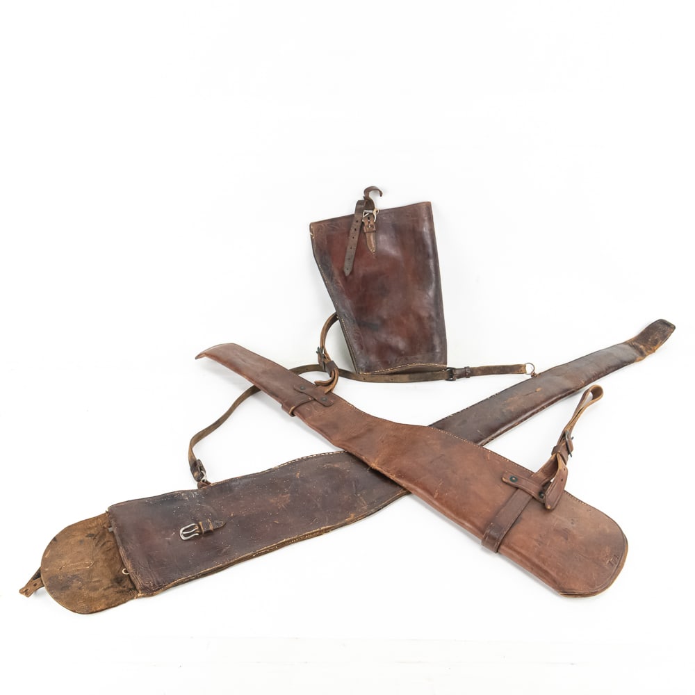 Vintage Leather Scabbard & Tool Bag Group: This historically rich collection features two heavy-duty leather scabbards and a finely hand-tooled leather accessory bag. The 34-inch scabbard is of significant interest to military and saddlery