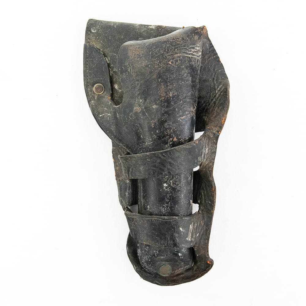 Double Loop Leather Holster: Double loop leather holster likely late 19th or early 20th century. A likely handmade dark leather revolver holster exhibiting a rich patina as well as cracks and verdigris consistent with age and use
