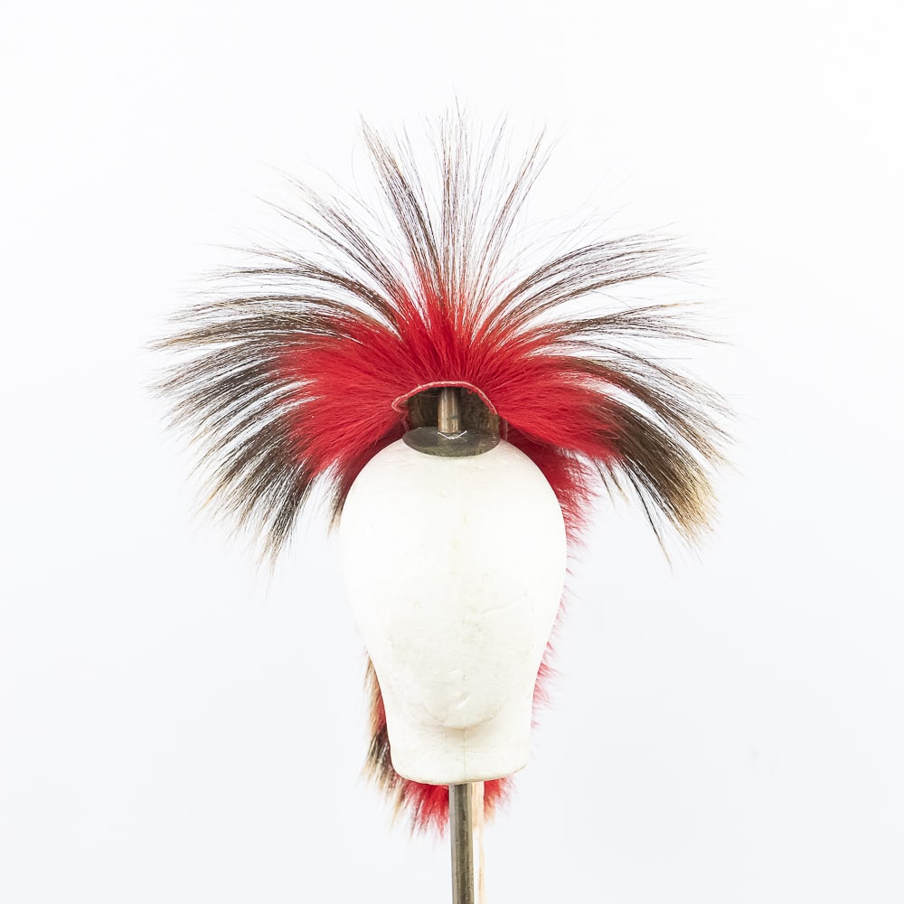 Northern Plains Roach w/Spreader: This vibrant Northern Plains roach with spreader likely dating from the mid-20th century, is a striking example of traditional indigenous regalia. Crafted from porcupine guard hairs and dyed deer