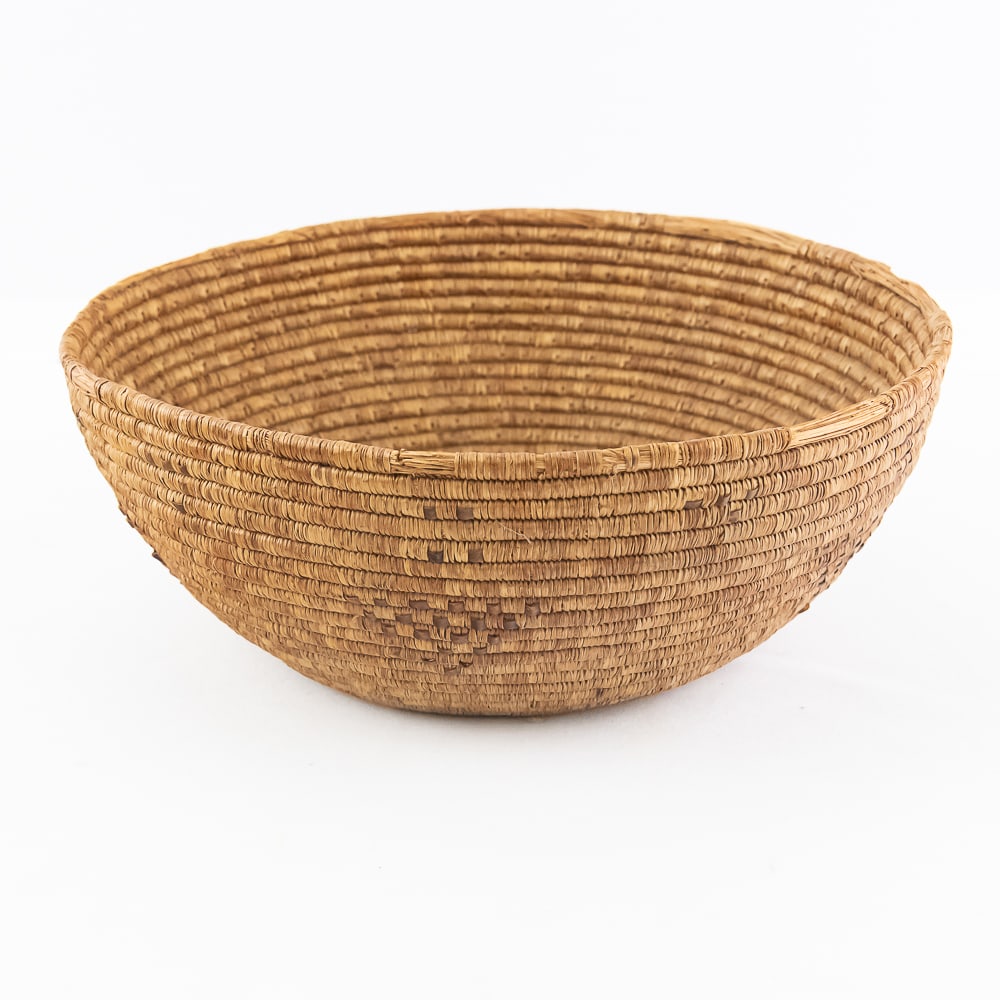 1915 Inuit / Yupik Coiled Bowl: Hand woven coiled bowl / basket made by either Yupik or Inuit people of Alaska, circa 1915. Tightly woven, this basket of bundled sea grass or ryegrass. Known as “Ivigak” it is durable