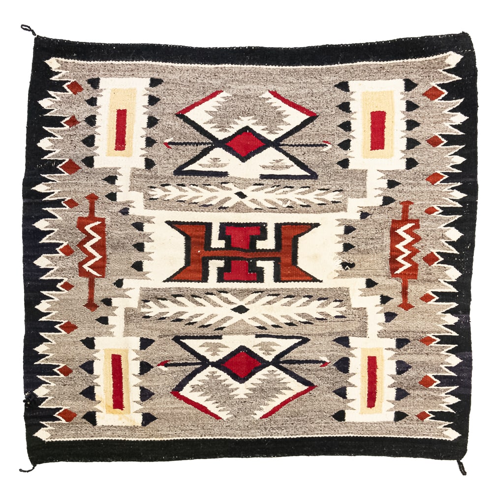 1960s Navajo Storm Pattern Blanket/Rug: Mid-20th century Navajo Storm Pattern blanket/rug. Design features a central rectangular motif traditionally interpreted as a Hogan or the center of the universe rendered in bold red, black, cream