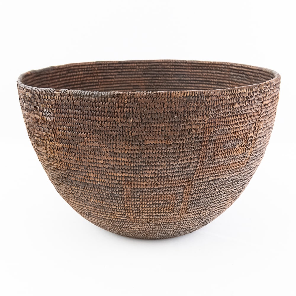 1920s Southwest Basket: This is a large, likely White Mountain Apache basket, circa 1920’s. It features a deep bowl-like shape and has a repetitive checkerboard pattern (each square approximately 3”x3”).