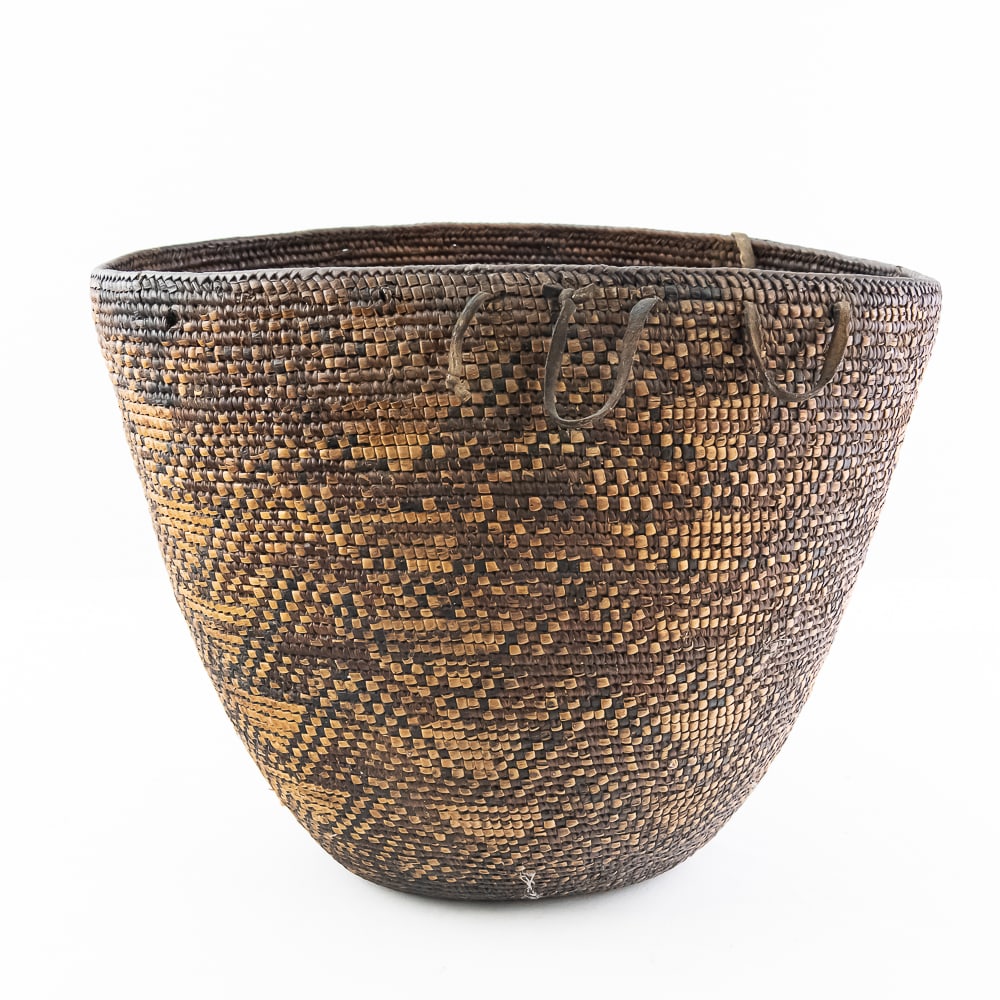 19C Skokomish Cedar Grass Berry Basket: 19th century Skokomish Berry basket sold at Hudson Bay Fur Company Inc. Seattle WA. It features a dark woven design with narrow vertical bands of imbrication that intersect with three wider
