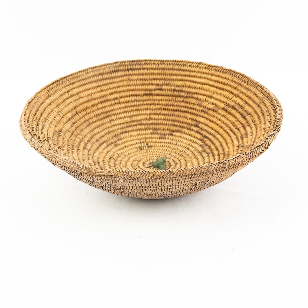 1890s Navajo Basket: A traditional woven Navajo basket circa 1890’s. This basket is adorned with a design (faint but present) called the Spider Woman cross which according to Navajo beliefs represents spider-woman