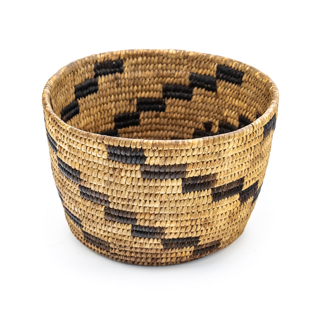 1960 Papago Basket: This Papago basket crafted around the 1960s exemplifies the traditional artistry of the Tohono O’odham (formerly known as Papago) people of the Sonoran Desert. The basket features a tightly