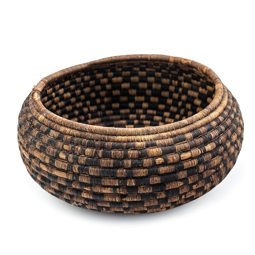 1900s Pomo? Basket: This basket is likely made by the Pomo peoples indigenous to Northern California. Their baskets are renowned for their intricate weaving techniques, diverse materials, and cultural significance. This