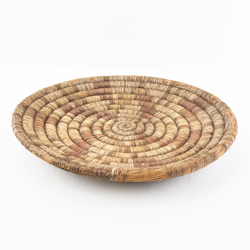 1890s Hopi Coiled Plaque: 1890's Hopi hand woven coiled plaque. Consisting of 12 tightly woven spiraling coils, with this particular piece featuring a geometric pattern. The coil wraps remain intact with nearly all present.