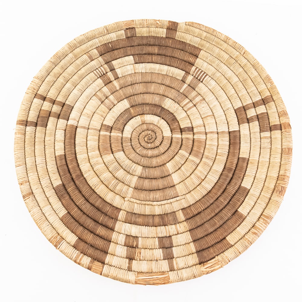 1920s Hopi Katchina Plaque: 1920's Hopi coiled plaque. Traditional labor intensive close-coil technique, consisting of 15 tightly woven spiraling coils, with this particular piece features a Kachina Crow Mother design pattern.