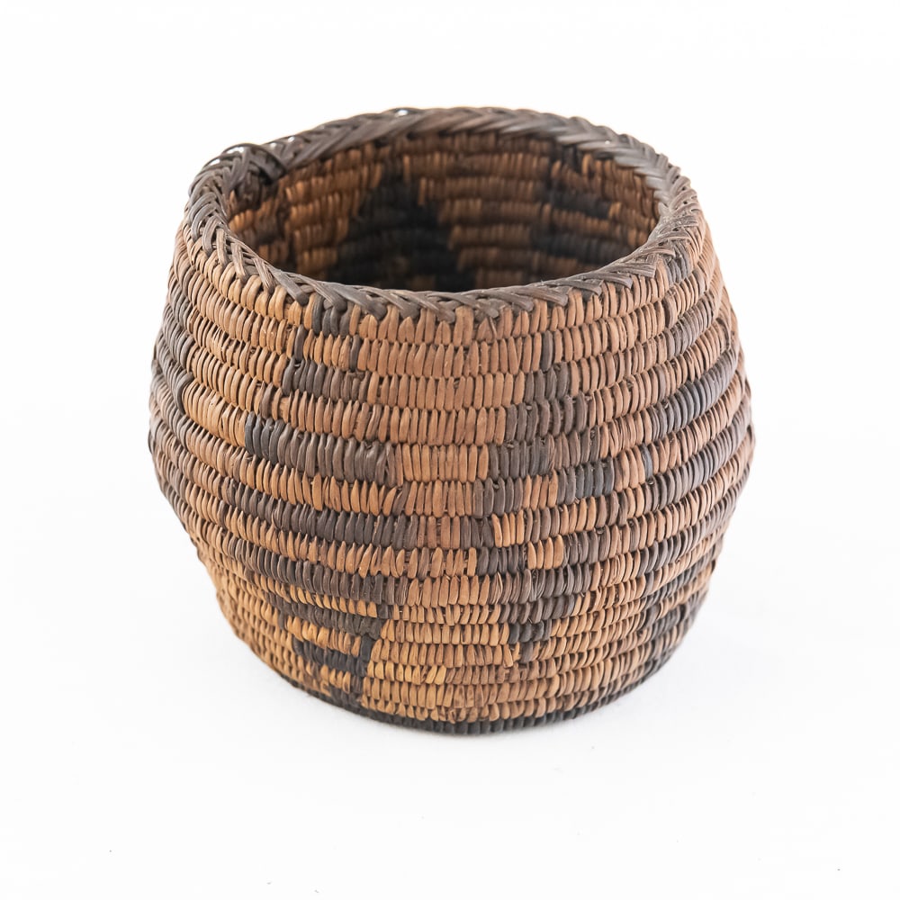 1940s Pima (Akimel O’odham) Basket: Pima (Akimel O’odham) basket from the 1940s Pima woven basket circa 1940s. This small rounded basket exemplifies the artistry of Pima (Akimel O’odham) weaving from the mid-20th century.