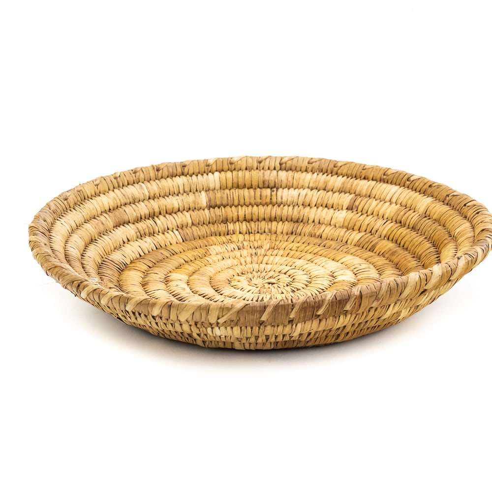 1960s Papago Tohono O'odham Bowl: Papago Tohono O’odham coiled basket manufactured in the 1960s. It is both functional and artistic reflecting the tribes cultural heritage and environment. The core is either made of Yucca or