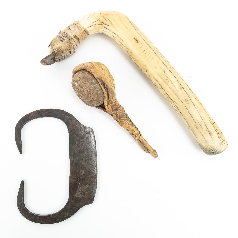 Indigenous Bone Adze, Stone Club & Ulu: This compelling ethnographic trio features a carved bone adze handle decorated with traditional geometric dot-and-line motifs, featuring an iron blade securely hafted with natural cordage. The