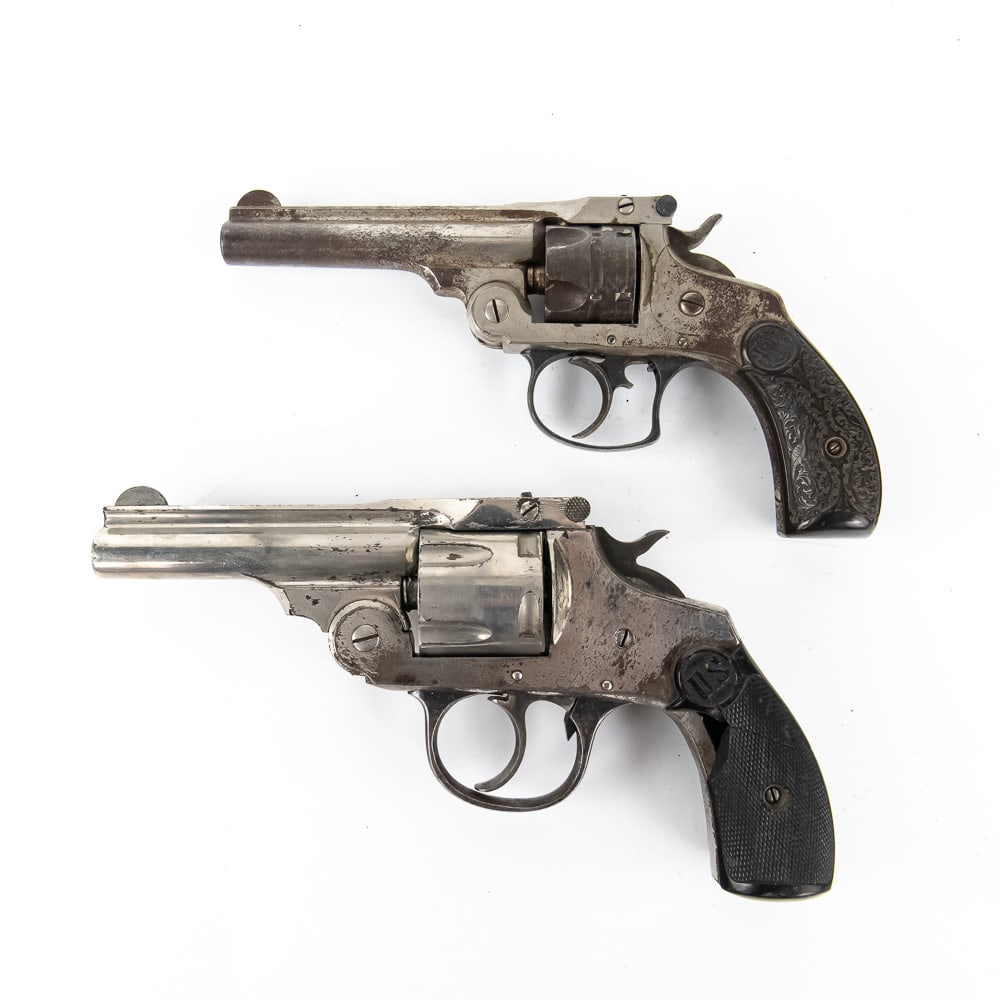 Pair of American Top Break Revolvers (C): Two classic, late 19th to early 20th-century American top-break revolvers, popular for their simple design and quick spent casing ejection. The first is a U.S. Revolver Co. Top-Break Double Action Rev