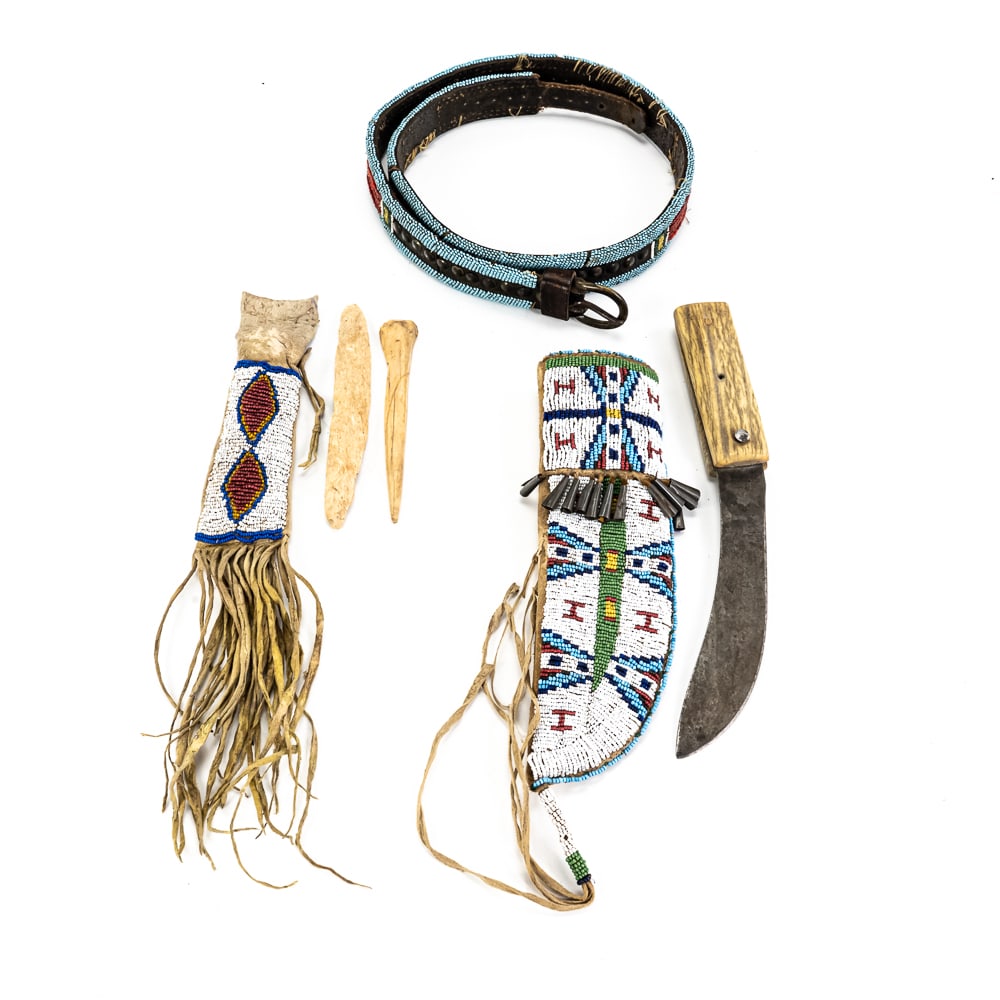 Beaded Plains-Style Set & Ontario Knife: This collection features a high-carbon steel "True Edge" butcher knife manufactured by the Ontario Knife Co. in the USA, featuring a pinned wood handle and a blade with a rich, aged patina. The set