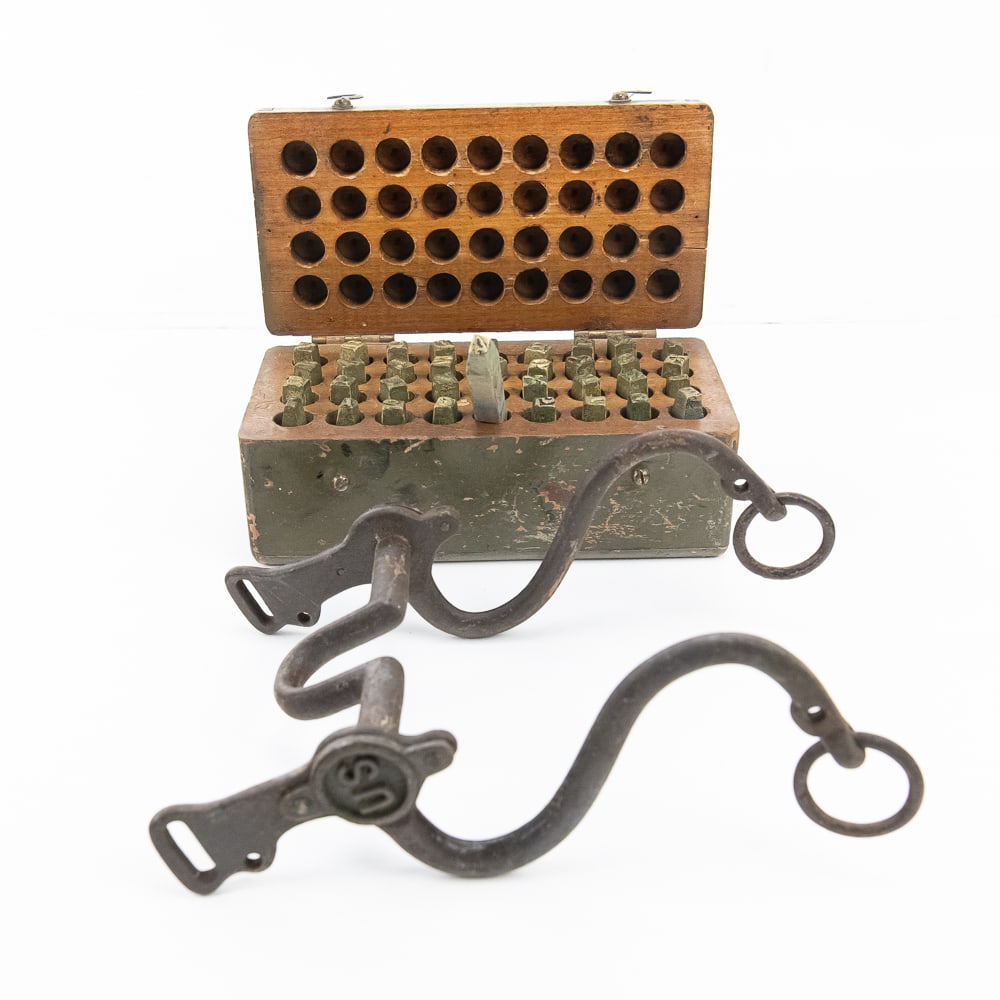 U.S. Cavalry Bit & Brass Stamp Kit: This quintessential pairing of American cavalry history includes a classic U.S. military curb bit and a complete vintage olive drab "Marking Outfit for Stamping Leather." The bit is a textbook
