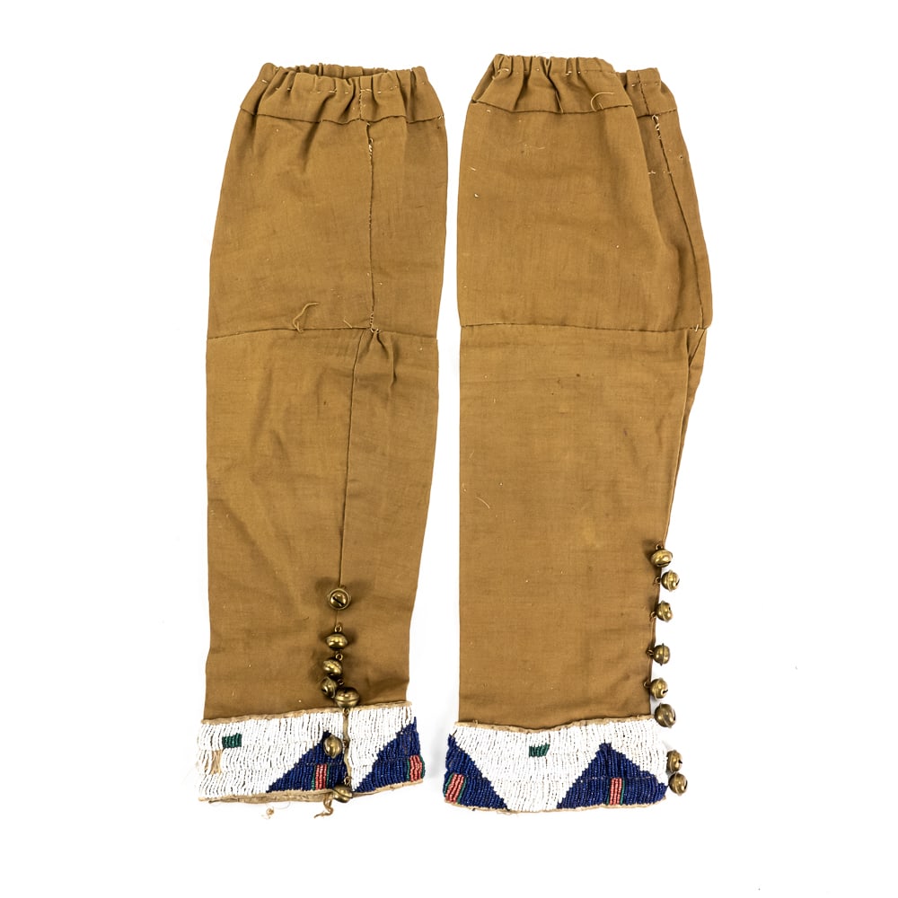 Blackfoot Beaded Boy's Cotton Leggings: These striking leggings, identified by the collection tag as Blackfoot and originating from the J.D. Allen collection, represent a wonderful piece of Indigenous Plains-style artistry. Based on the