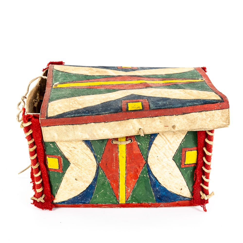 Hand-Painted Plains Rectangular Parfleche Box: This striking Plains-style parfleche box is a wonderful example of traditional-style hide work, featuring vibrant geometric motifs in red, yellow, green, and blue. Constructed from stiff, folded