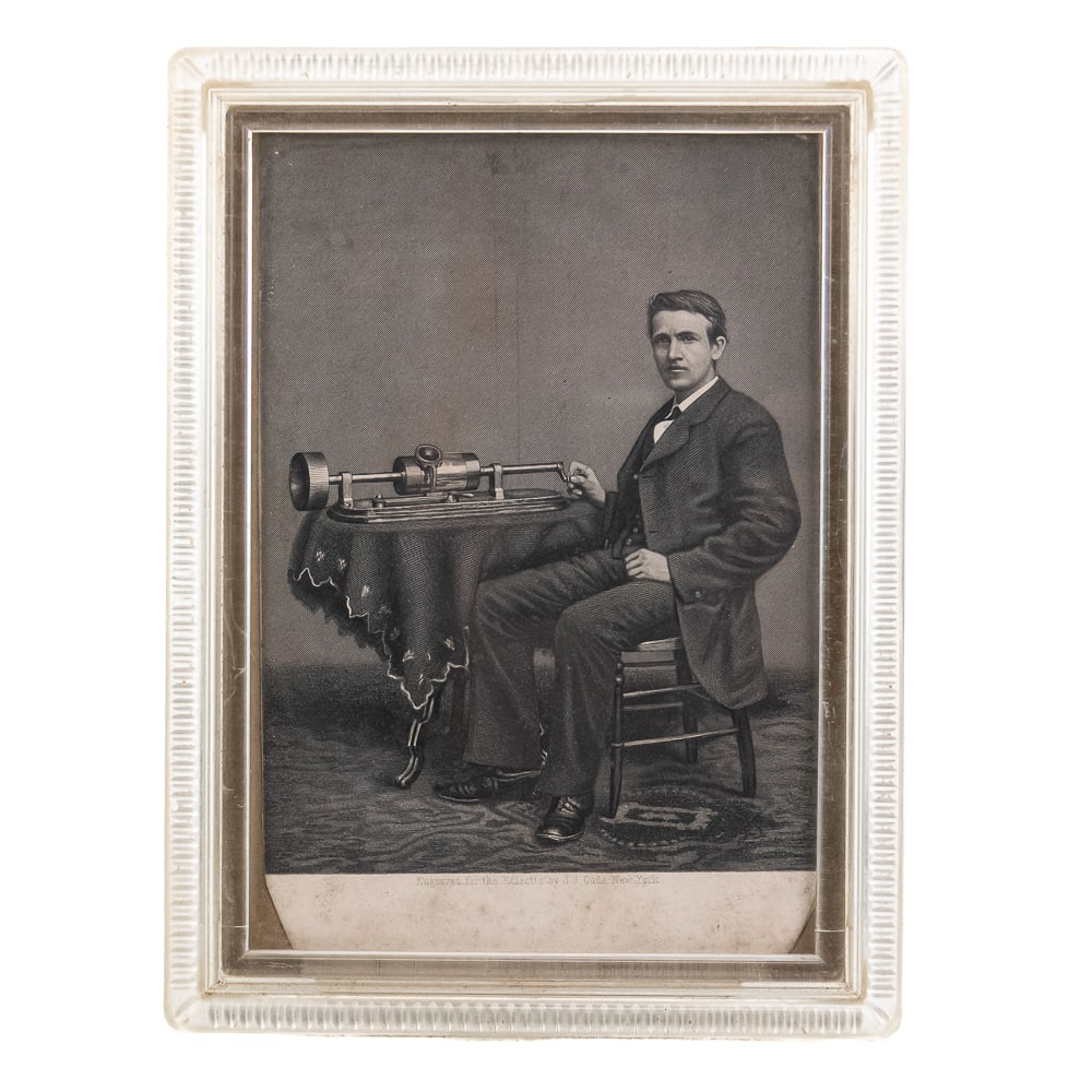 1878 Engraving of T.A. Edison by J.J. Cade: A 1878 original steel engraving of Thomas Alva Edison and his tinfoil phonograph, custom-made for publication in The Eclectic Magazine of Foreign Literature, Science, and Art by J.J. Cade of New York.