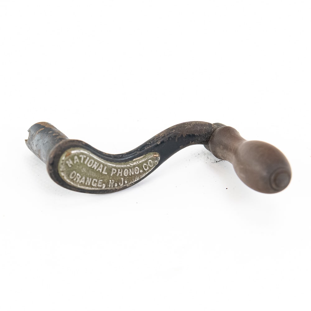 Early Edison National Phonograph Co Crank: Early desirable slotted Edison crank with a desirable nickel-plated tag stating "National Phonograph Company, Orange, New Jersey". Crank has its original black paint and wooden knob in average conditi