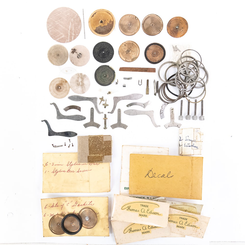 Large Jackpot Lot of Edison Reproducer Parts: Includes many cylinder phonograph diaphragms, binding rings, lifting tabs, retention tabs, hinge blocks, and more. A very useful lot, see photos. From the Allen Koenigsberg Collection