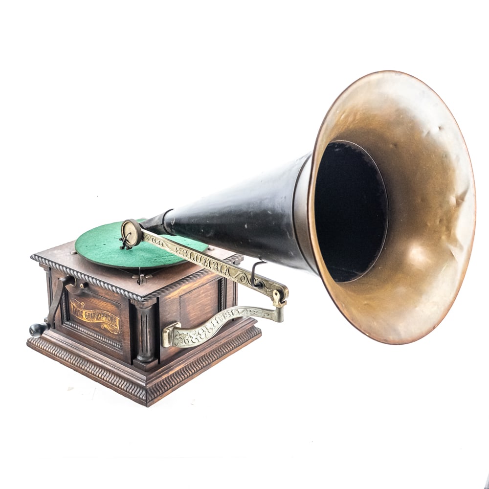 Columbia AH Disc Phonograph: This is the first style AH introduced by Columbia in 1901. It is all original with the exception of the cast aluminum tone arm/horn support. The tone arm is original. Original finish oak cabinet is