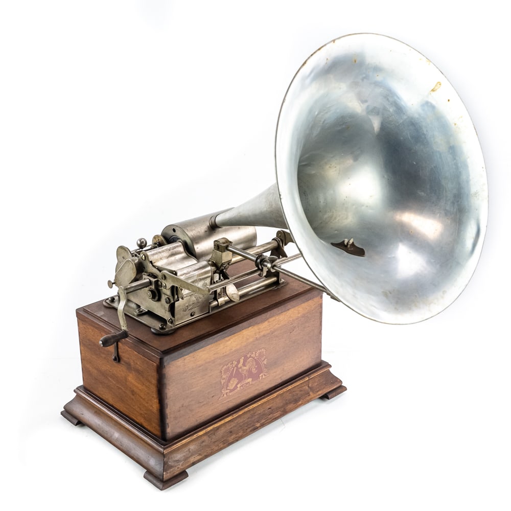 Pathe Coq Cylinder Phonograph: Nice all original flip top Pathe Coq plays both standard and salon cylinders. Original finish case, good plating on parts, machine winds and runs. Comes with a gutta percha reproducer and a 14" long,